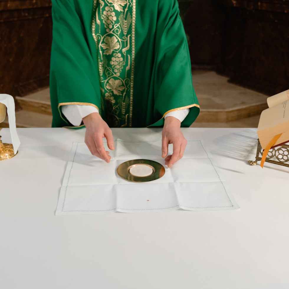 a priest celebrating a holy mass